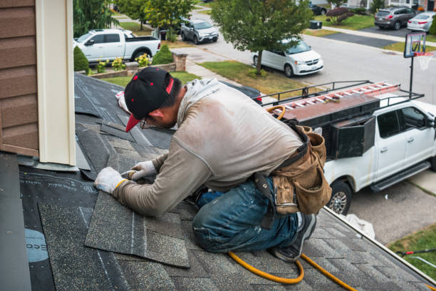 Professional Storm Damage Roof Repair technician working in Woburn, MA